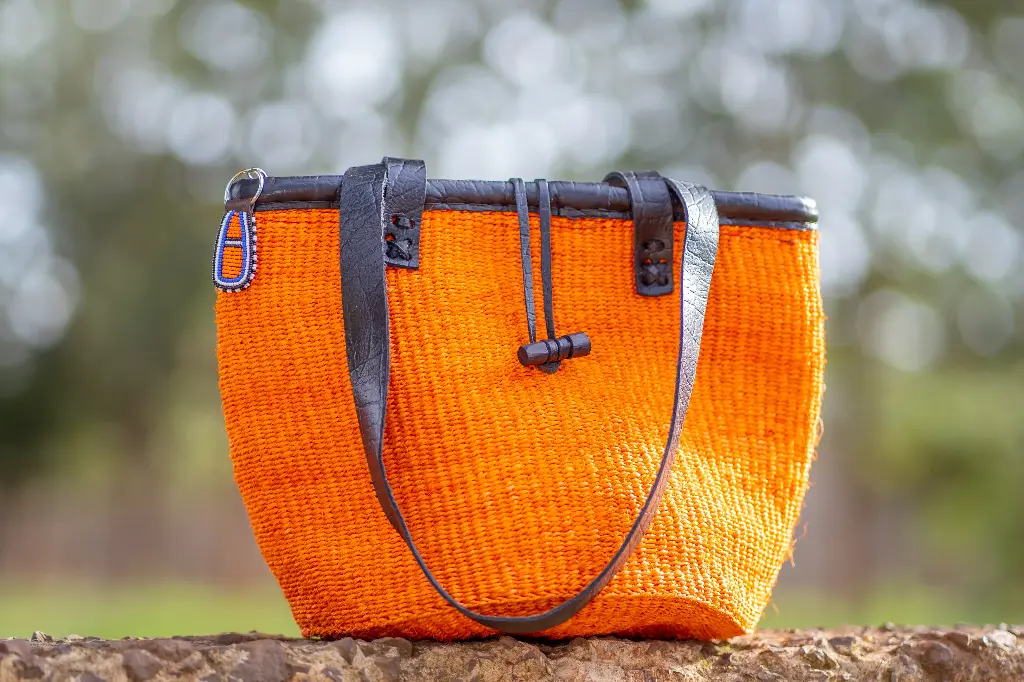 Orange kiondo bag with leather binding -Size 10